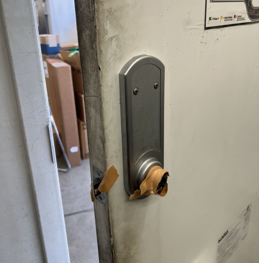 Broken door lever taped up before replacement, Mebane NC