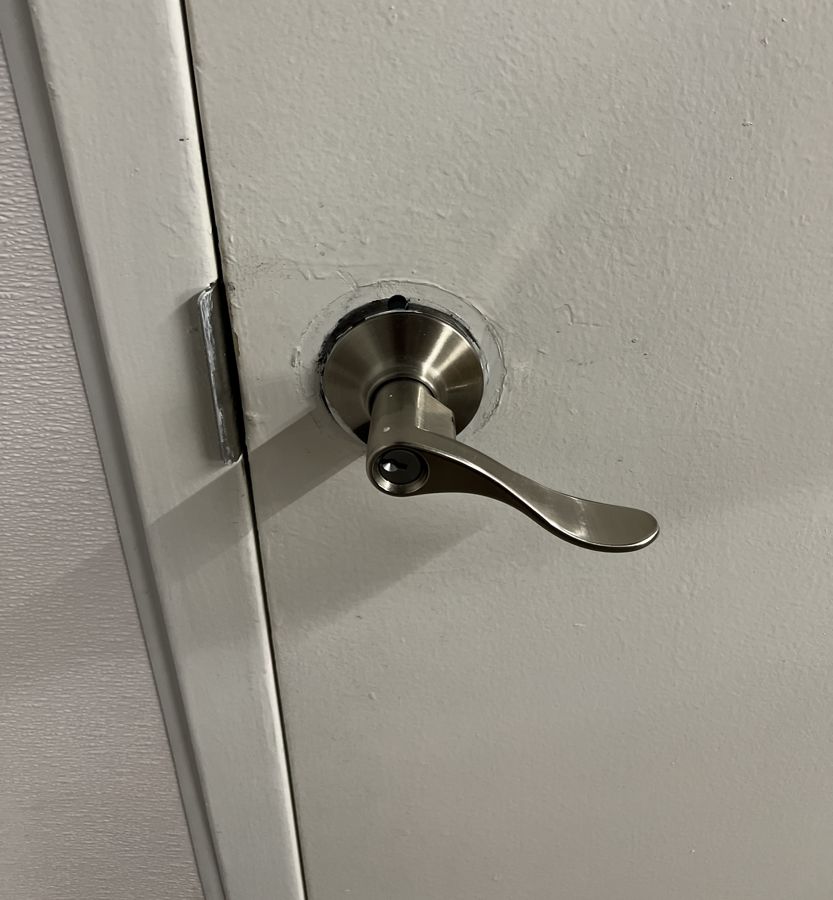 Misaligned lever in a rough cutout before repair, Charlotte NC