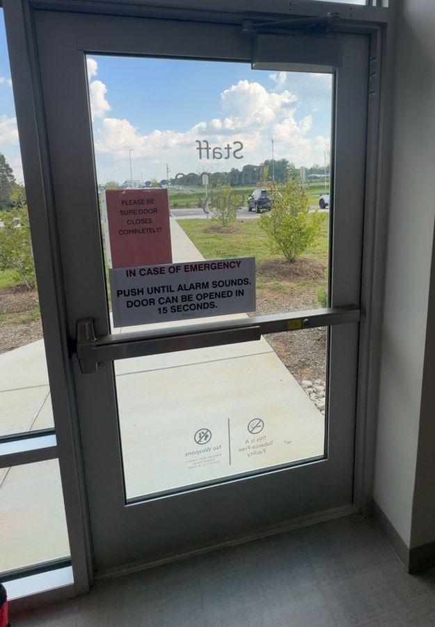 Door closer reattached and adjusted on a staff entrance, Concord NC