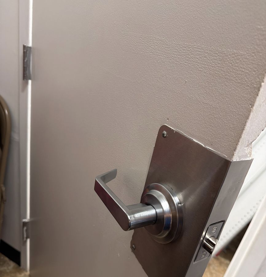 Other side of the same door with the new lever lock in place, Charlotte NC